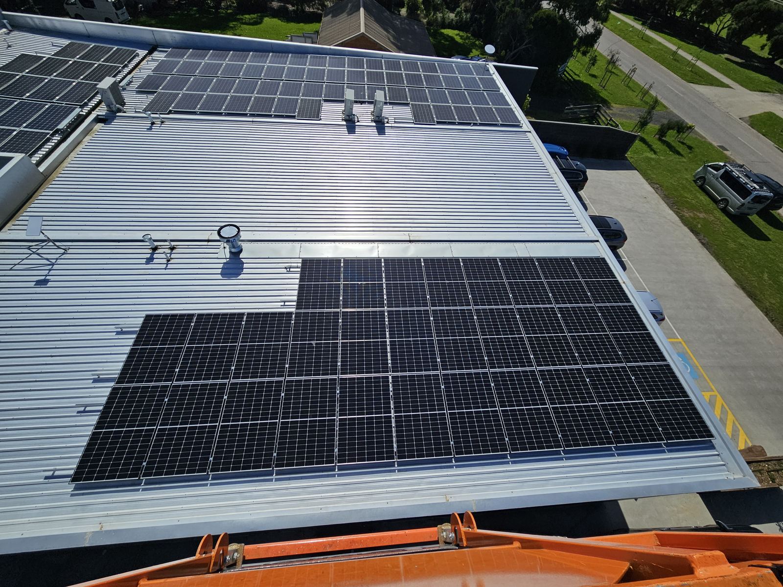 Commercial solar panel installation on a large roof, Glen Waverley