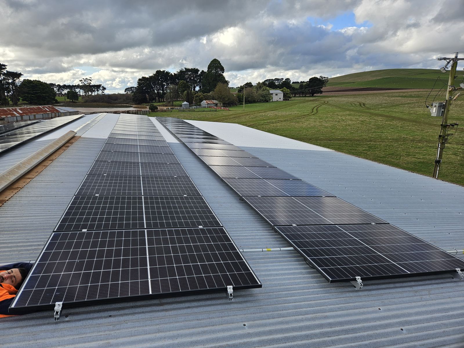 Rural solar panel installation on a farm shed roof, Gippsland