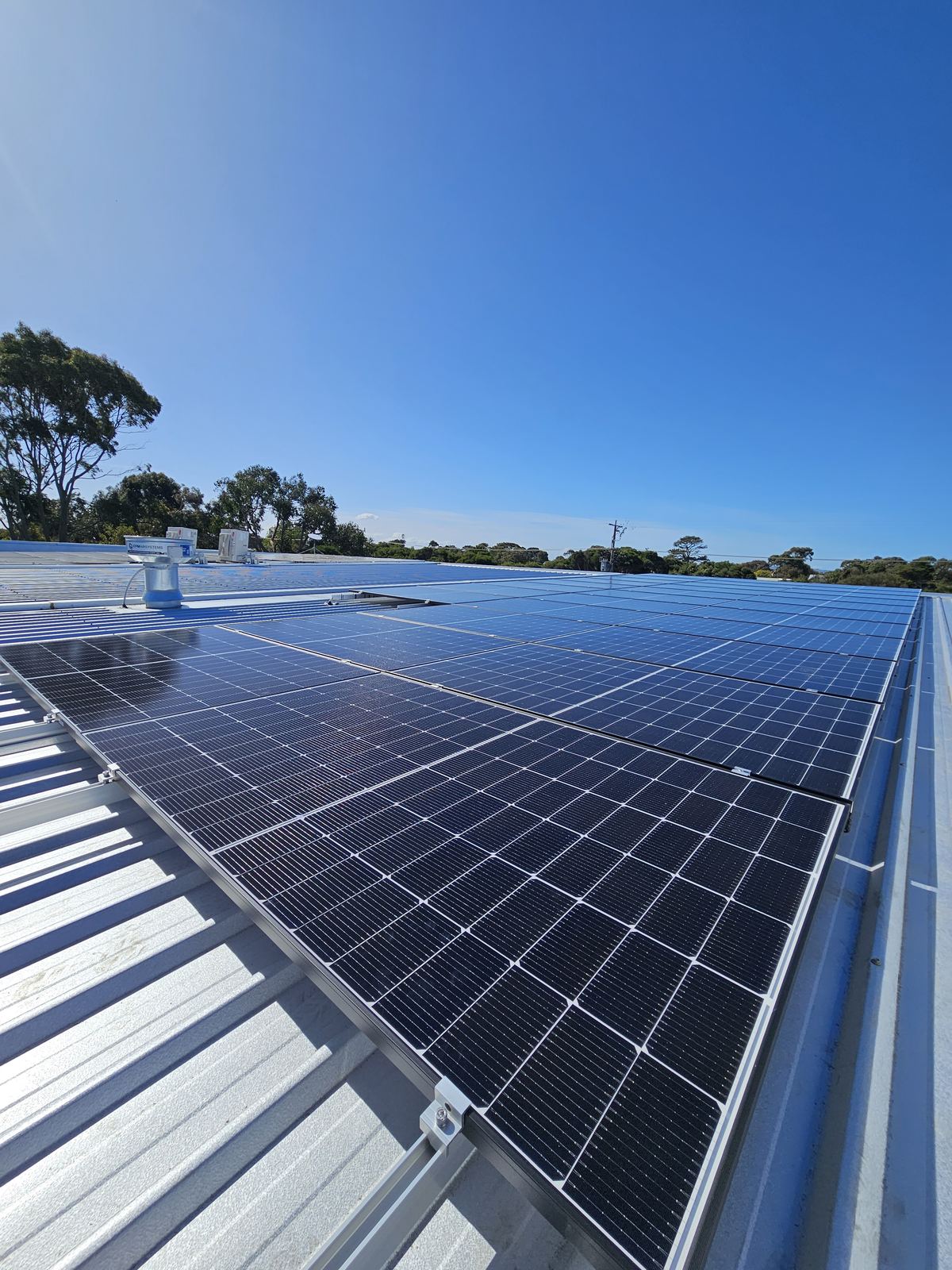 Solar panel installation on a metal roof, North Suburbs