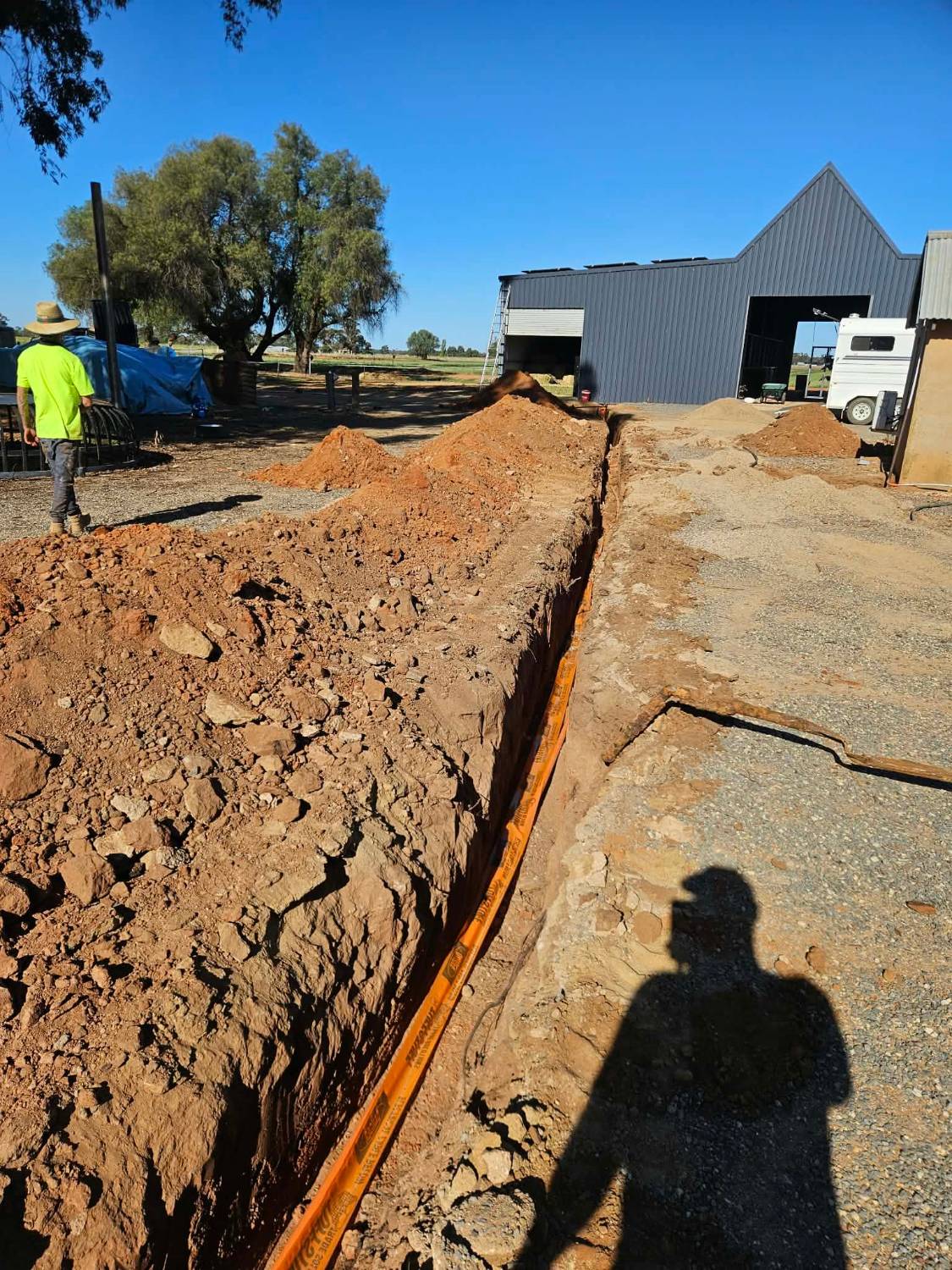 Underground cable installation trench on a rural property, North Suburbs